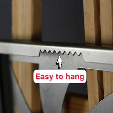 Close-up of a metal wall art hanging bracket with sawtooth edge and an Easy to hang label