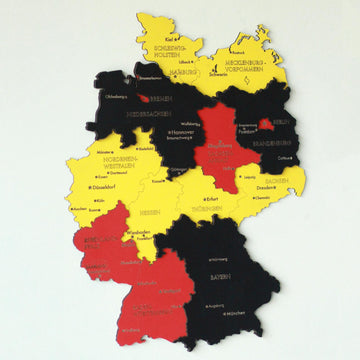 3D wooden Germany map in black, red and gold flag colors with state and city names, including Bavaria and Hesse
