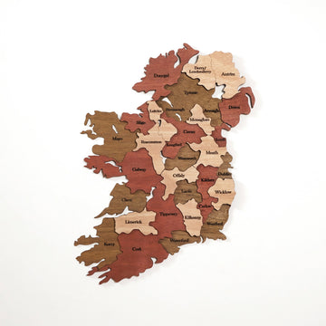 Ireland wooden wall map with county names in brown, rust red and light wood layers on a white wall