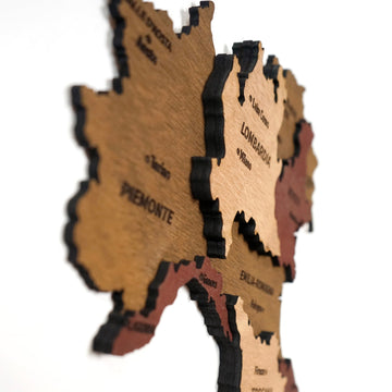 Close-up of the Italy wooden wall map showing Piemonte and Lombardia in layered wood from a side angle
