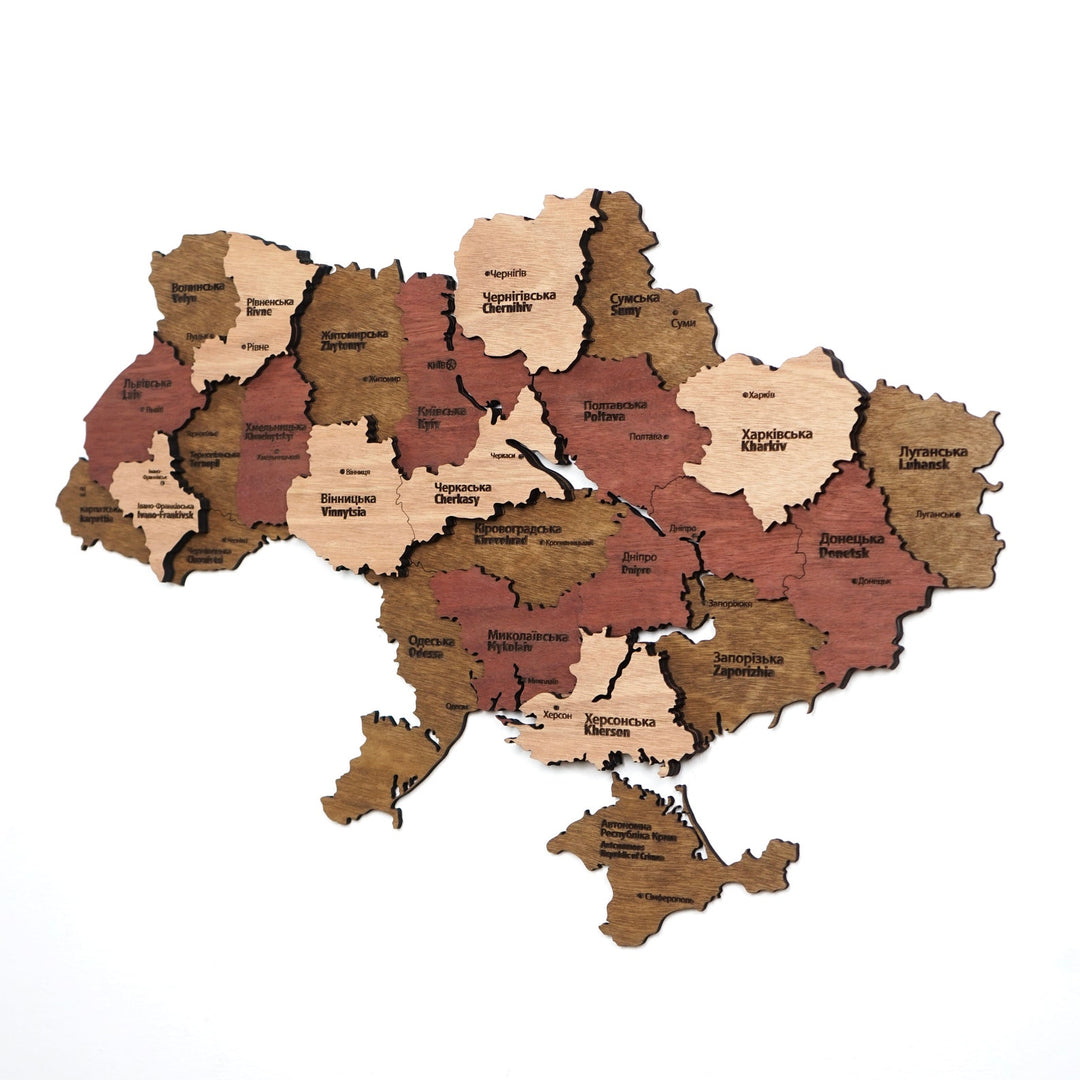 Ukraine wooden wall map with oblast names in brown, rust red and light wood layers, front view on white