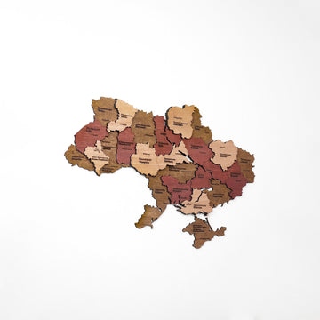 Small Ukraine wooden wall map on a white wall with generous empty space around it