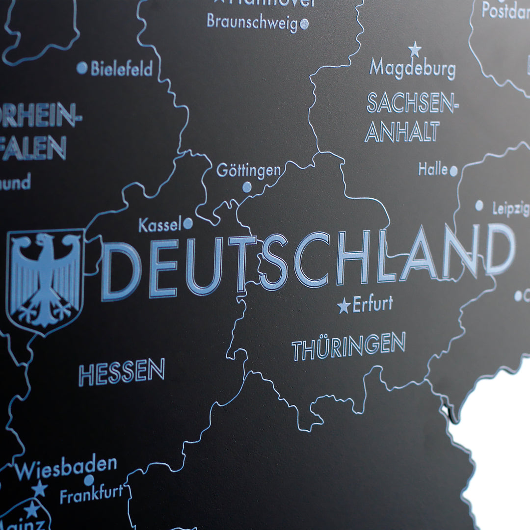 Close-up of the black metal Germany map with the Deutschland eagle logo, Hesse, Thuringia and Erfurt