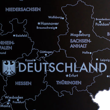 Close-up of the black metal Germany map with Deutschland logo, Hannover, Wolfsburg and Magdeburg